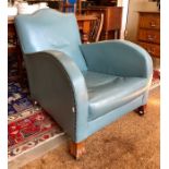 An Art Deco blue leather covered armchair