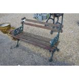 A cast metal and teak slatted garden bench