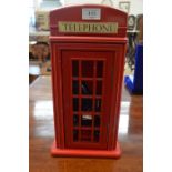 A 1980s Dialatron 'designer telephone' 9000 in red telephone kiosk for wall-mounting