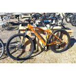 A Carrera Vengeance hardtail mountain bike with orange frame [p19003810]