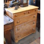 A waxed pine chest of two short over three long drawers with turned handles and bun feet