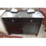 A Laura Ashley ebonised sideboard with two drawers over panelled cupboard doors