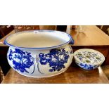 A blue and white basin with floral designs, 45 cm wide, together with blue and white circular