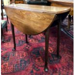 A George III mahogany oval drop leaf padfoot supper table