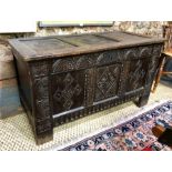 A late 17th/18th century carved oak coffer