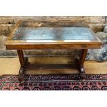A Victorian rosewood leather-top writing table