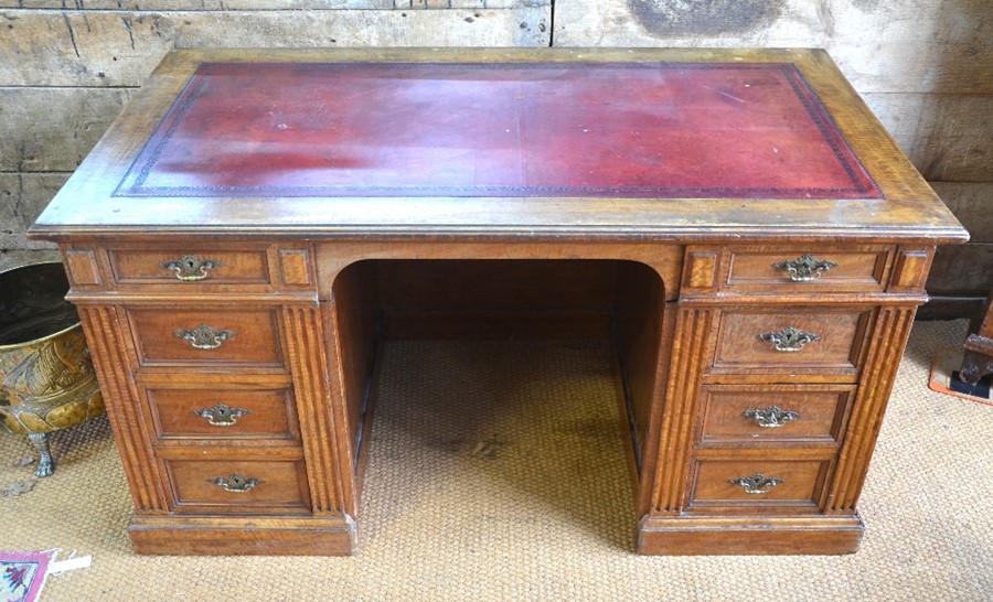A late 19th century oak/pollard oak twin pedestal desk