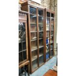 Edwardian walnut glazed library cabinets