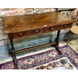 An Egyptian Revival style mahogany two drawer side table