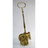 A cast brass rams head doorstop