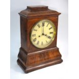 S Tritshler, schollach, a late 19th/20th century walnut cased 8-day mantel clock
