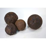 Four cast iron cannon balls