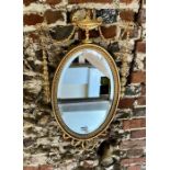 A Victorian gilwood and composite oval mirror