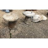 A pair of weathered antique hand cut Hampshire stone staddle stones and caps