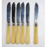 Six silver fish knives with ivory handles