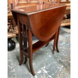 An Edwardian walnut Sutherland table