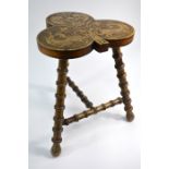 A poker work trefoil stool