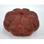 A Chinese melon-shaped cinnabar lacquer bowl and cover