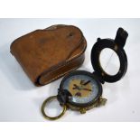 A brass and lacquered pocket bearing-compass