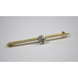 A yellow and white metal knife edge bar brooch