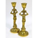 A pair of 19th century Continental brass candlesticks