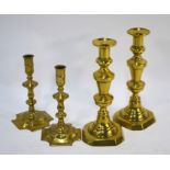 Four pairs of Georgian and Victorian brass candlesticks