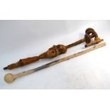 A carved wood walking stick