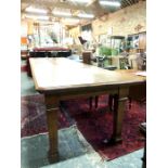 A late 19th/20th century golden oak refectory table