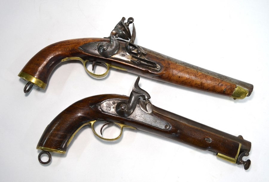 An Indian flintlock pistol and a percussion pistol