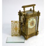 A 19th century Gothic style brass cased mantel clock