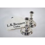 A pair of loaded silver baluster candlesticks, Harrison Brothers & Howson, Birmingham 1988