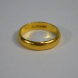 A 22ct yellow gold wedding band