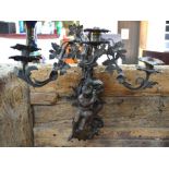 A good quality bronze three branch wall sconce