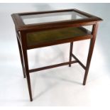 An Edwardian inlaid walnut vitrine table