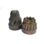 A Victorian copper jelly mould by Benham & Froud and another
