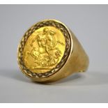 A 9ct ring set with gold sovereign