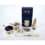 A silver condiment set, caddy spoon and other items