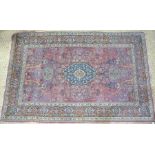 An antique Persian Meshed rug