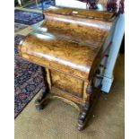 A Victorian bur walnut piano-top Davenport desk