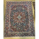 An antique Persian Mahal red and blue ground rug