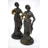 A companion pair of 19th century continental brown bronze figures