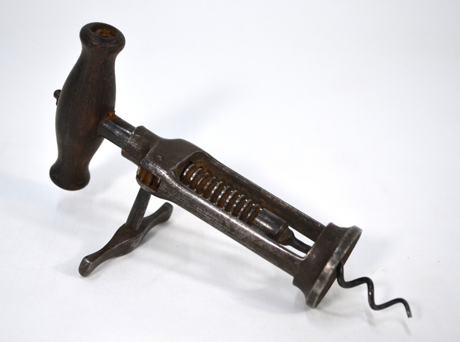 A Victorian steel two-pillar rack-and-pinion corkscrew with turned wood handle