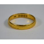 A 22ct yellow gold wedding band