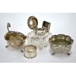 A glass inkwell with silver top, sauceboat, Chinese napkin ring and Indian bowl