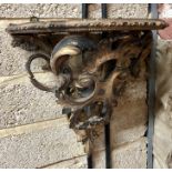 An antique Italianate rococo style wall bracket