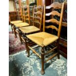 Four antique wavy ladderback rope seat chairs