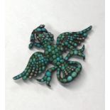 A Victorian silver set brooch in the form of a dove of peace with outstretched wings, carrying an