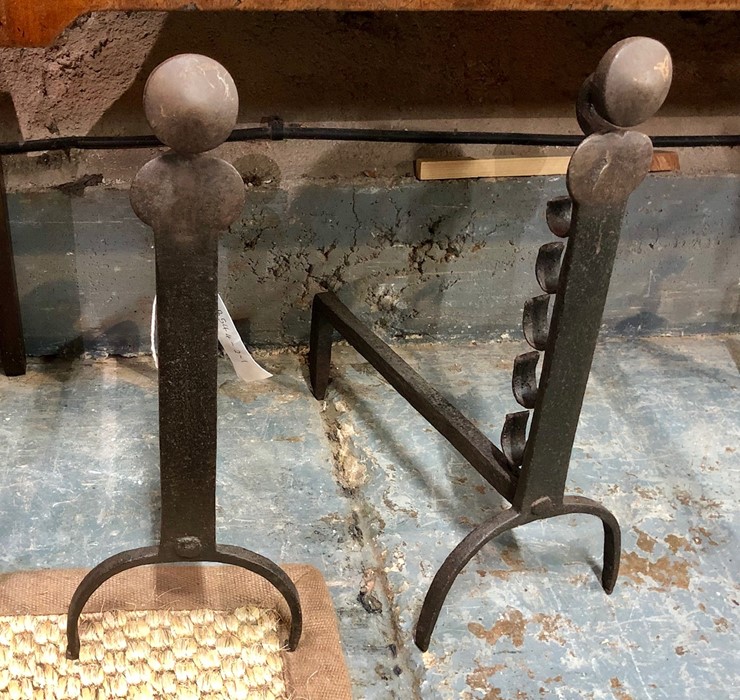 A companion pair of wrought steel fire dogs