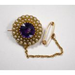 An antique amethyst and seed pearl brooch