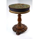 A Victorian mahogany revolving piano stool